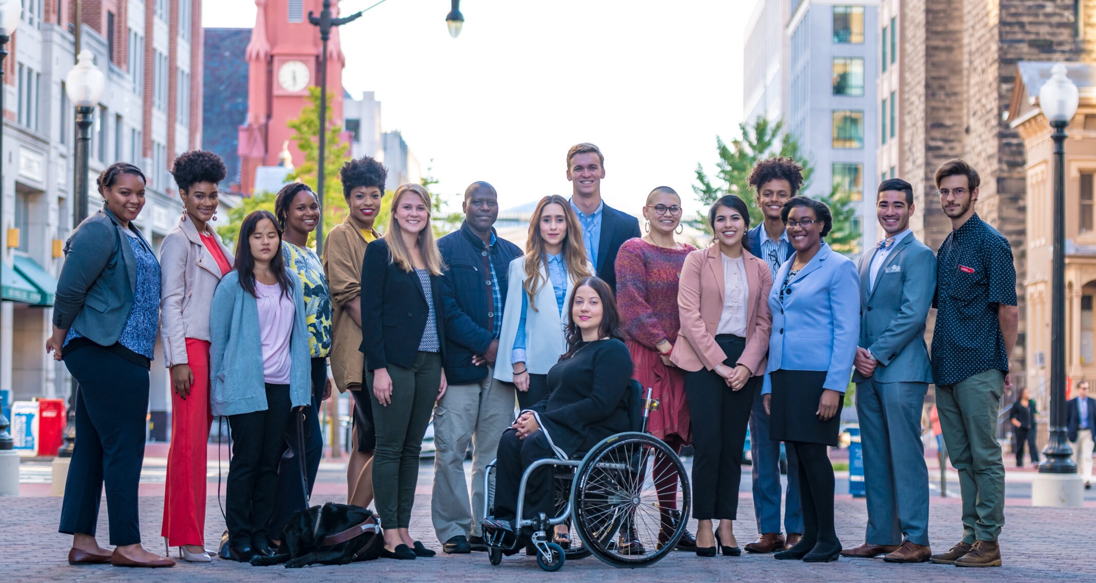 Diverse group of disabled people, ranging in race, gender, and disability.